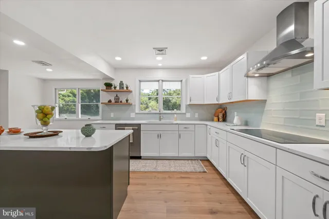 a kitchen with a refrigerator sink and microwave