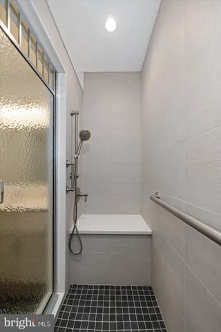 an aerial view of a residential houses with outdoor space and street view