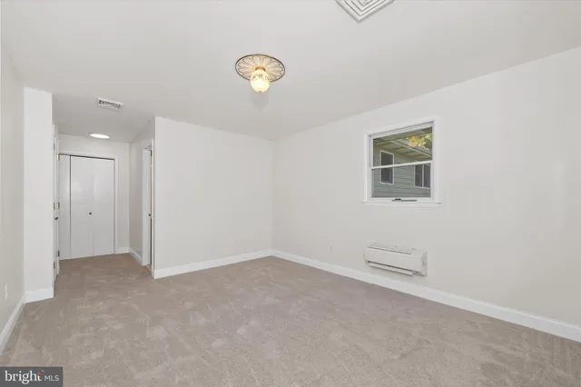 an aerial view of residential house with outdoor space and trees