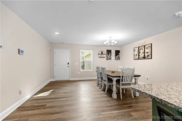 a open kitchen with stainless steel appliances granite countertop a lot of counter space and wooden floor