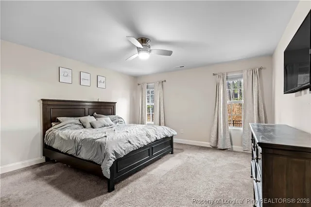 a living room with furniture kitchen view and a table