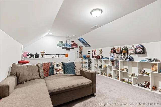 a bedroom with a bed and cabinets