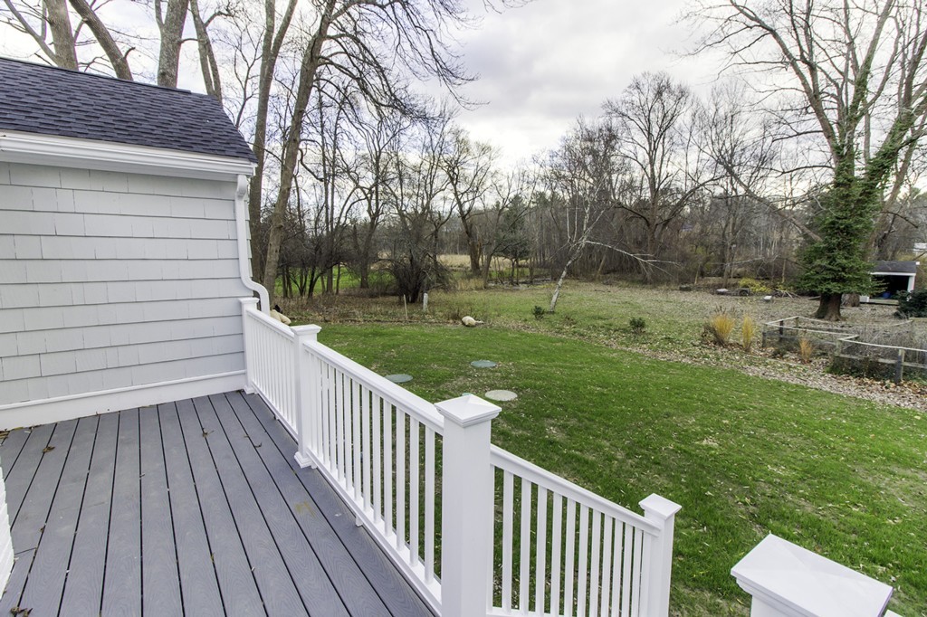 55 Argilla Road Ipswich, MA 01938 - Photo 20 of 26 a view of a wooden deck and yard with green space