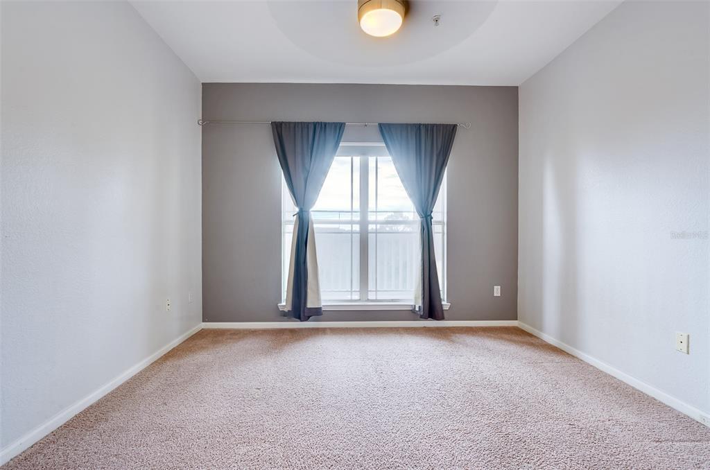 1216 South Missouri Avenue, Unit 311 Clearwater, FL 33756 - Photo 12 of 32 an empty room with windows
