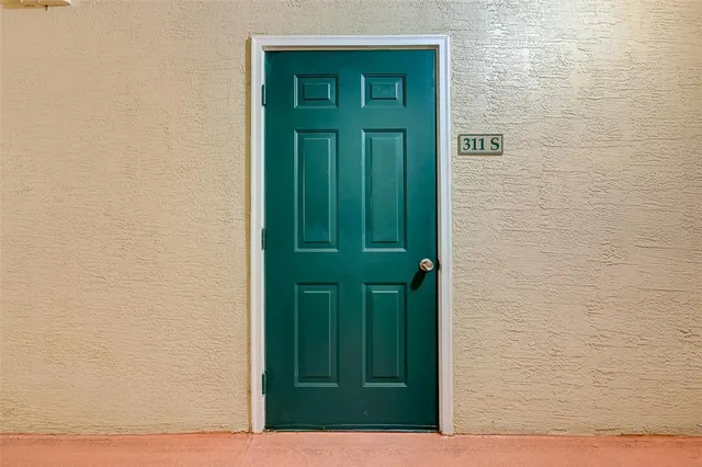 a view of door with yard