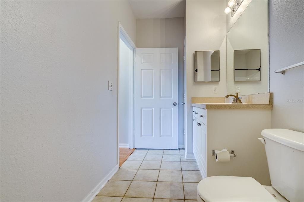 1216 South Missouri Avenue, Unit 311 Clearwater, FL 33756 - Photo 24 of 32 a bathroom with a sink a toilet and shower