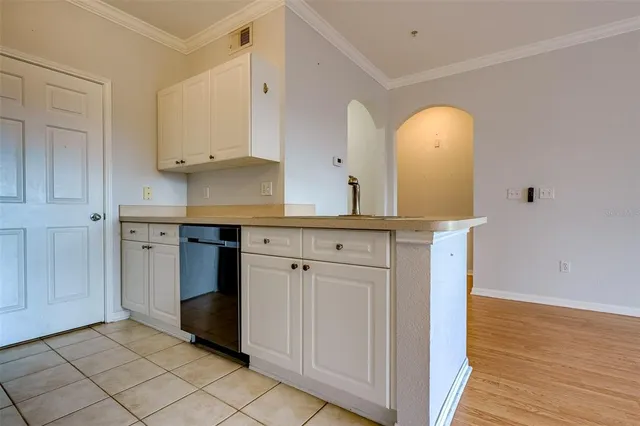 a view of a kitchen with sink and dishwasher