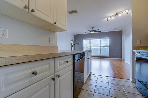 a kitchen with a sink and cabinets