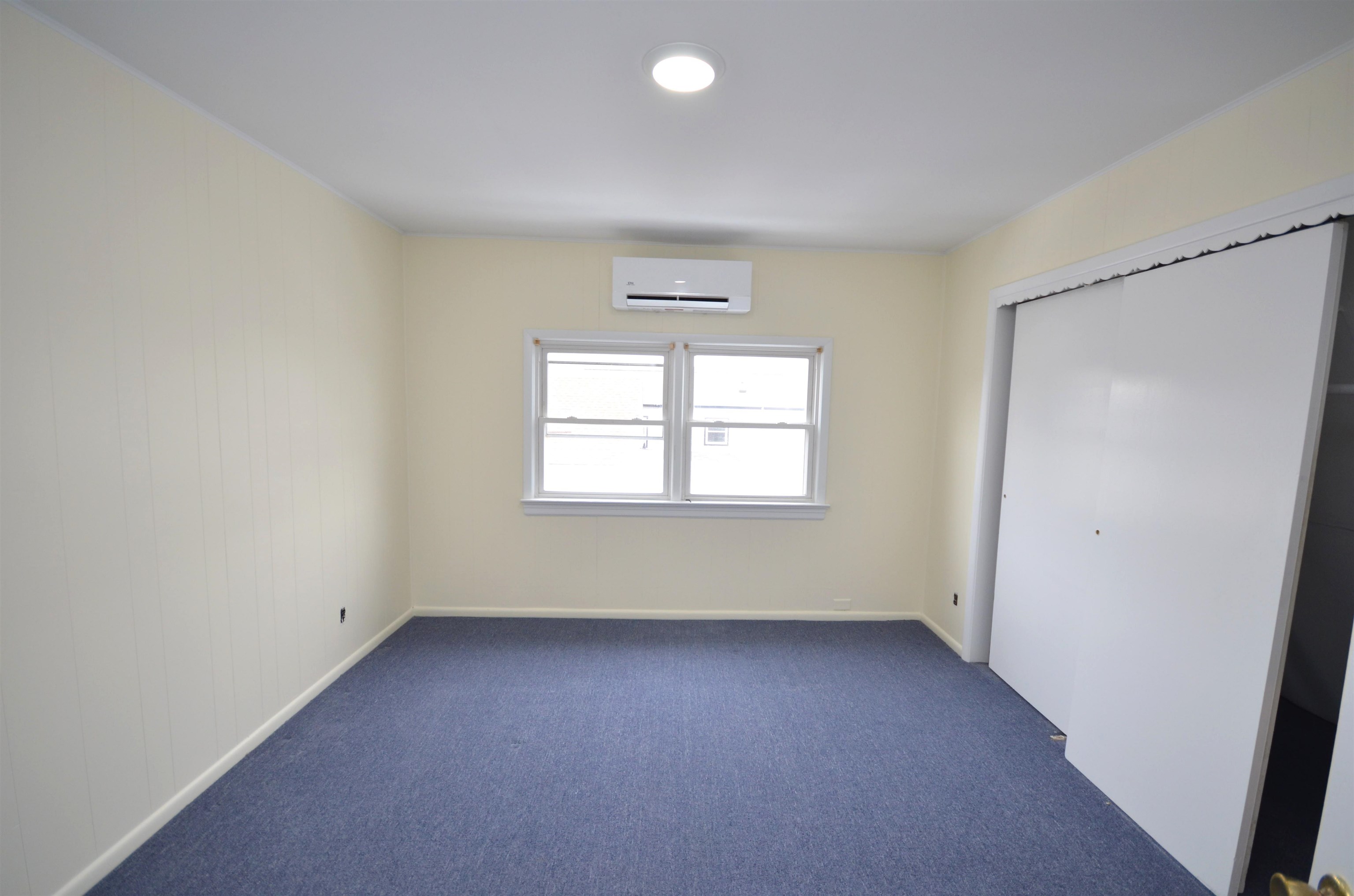 413 Davis Avenue, Unit 2 Harrison, NJ 07029 - Photo 12 of 14 an empty room with a window