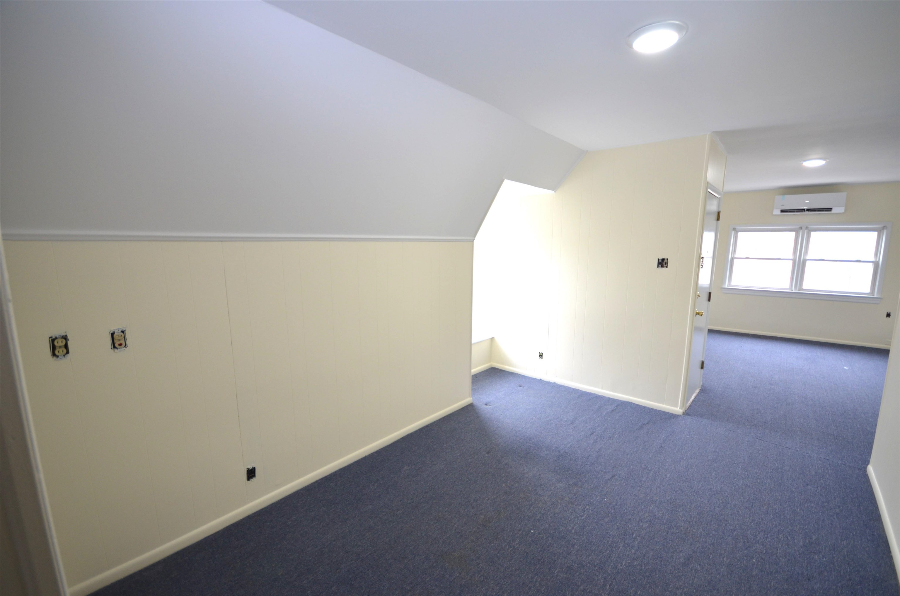 413 Davis Avenue, Unit 2 Harrison, NJ 07029 - Photo 13 of 14 an empty room with windows