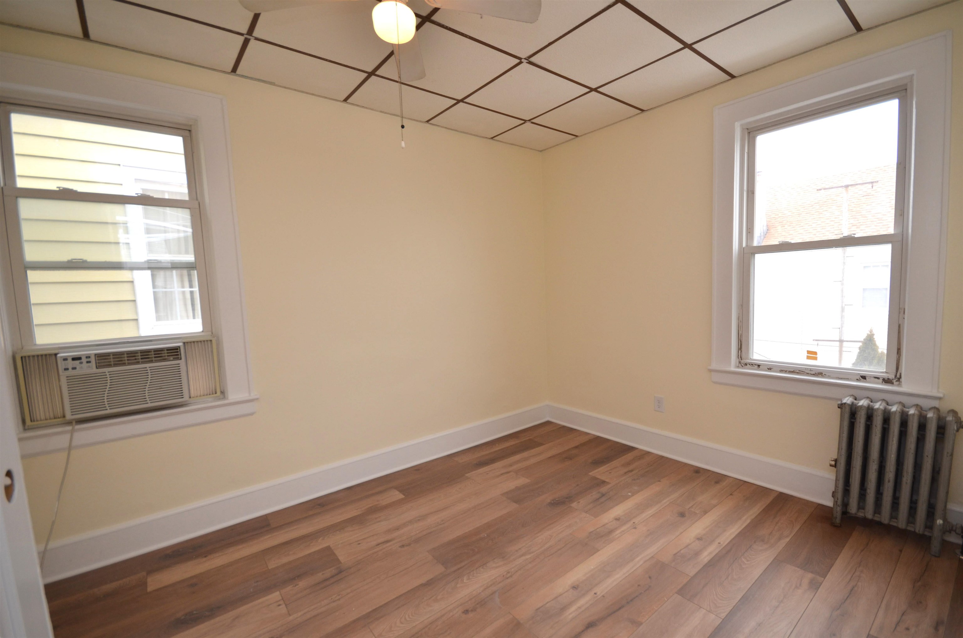 413 Davis Avenue, Unit 2 Harrison, NJ 07029 - Photo 4 of 14 a view of a room that has a window in it