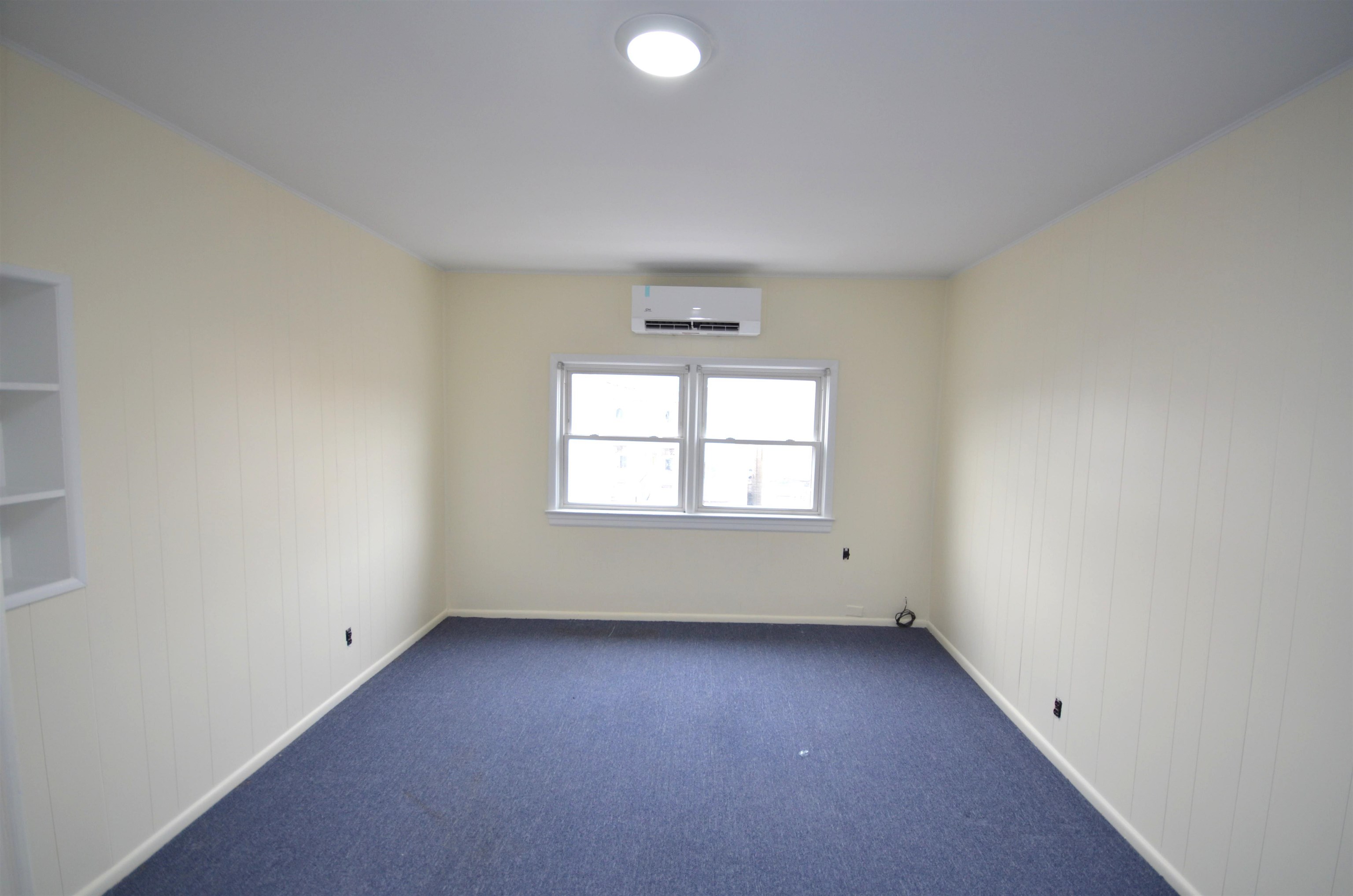 413 Davis Avenue, Unit 2 Harrison, NJ 07029 - Photo 9 of 14 an empty room with a window
