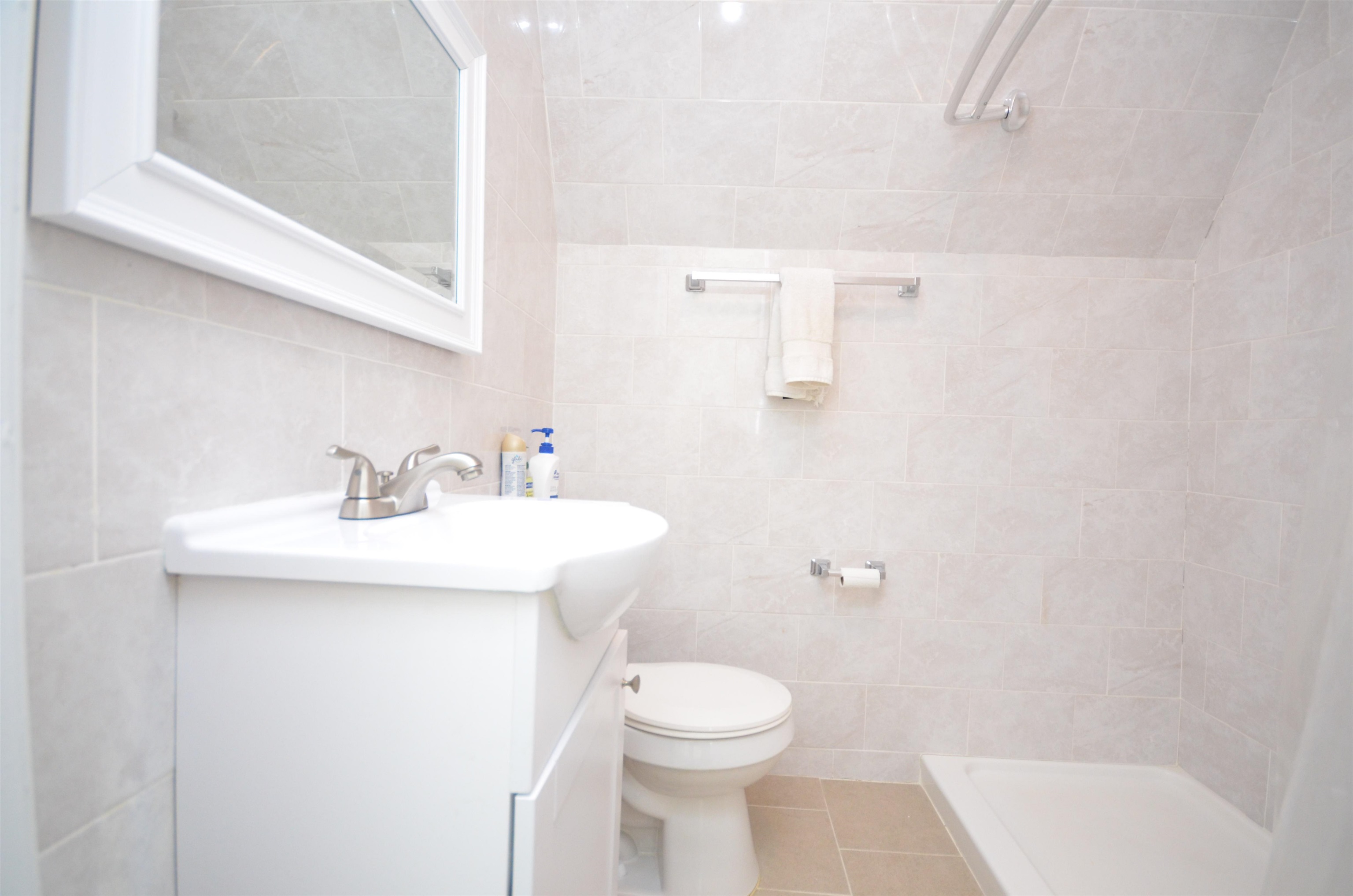 413 Davis Avenue, Unit 2 Harrison, NJ 07029 - Photo 10 of 14 a bathroom with a sink a toilet and shower