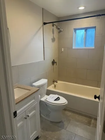 a bathroom with a sink a toilet and a bathtub
