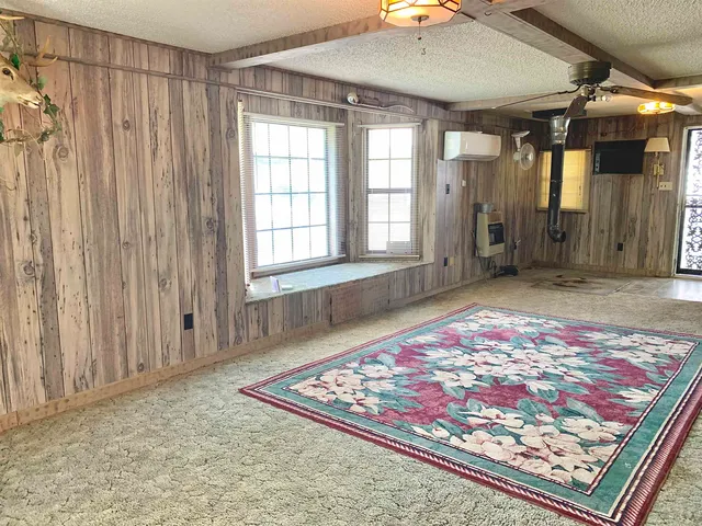 a view of a garage with wooden fence