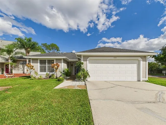 front view of a house with a garden