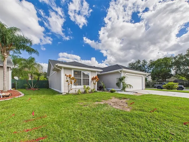 a view of a backyard of the house