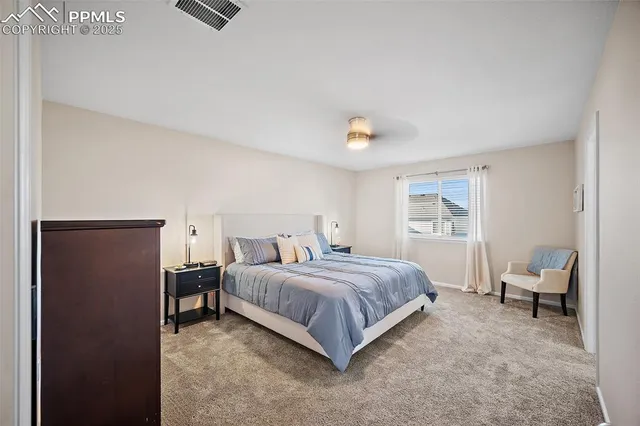 a bedroom with a bed and a couch