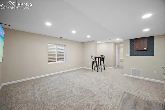 a room with a bed and a window in it