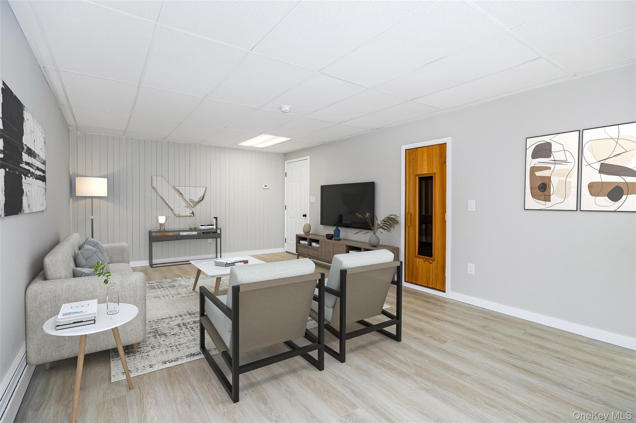 261 Freedom Road Pleasant Valley, NY 12569 - Photo 31 of 50 Living room featuring a drop ceiling, light wood-type flooring, and a baseboard heating unit