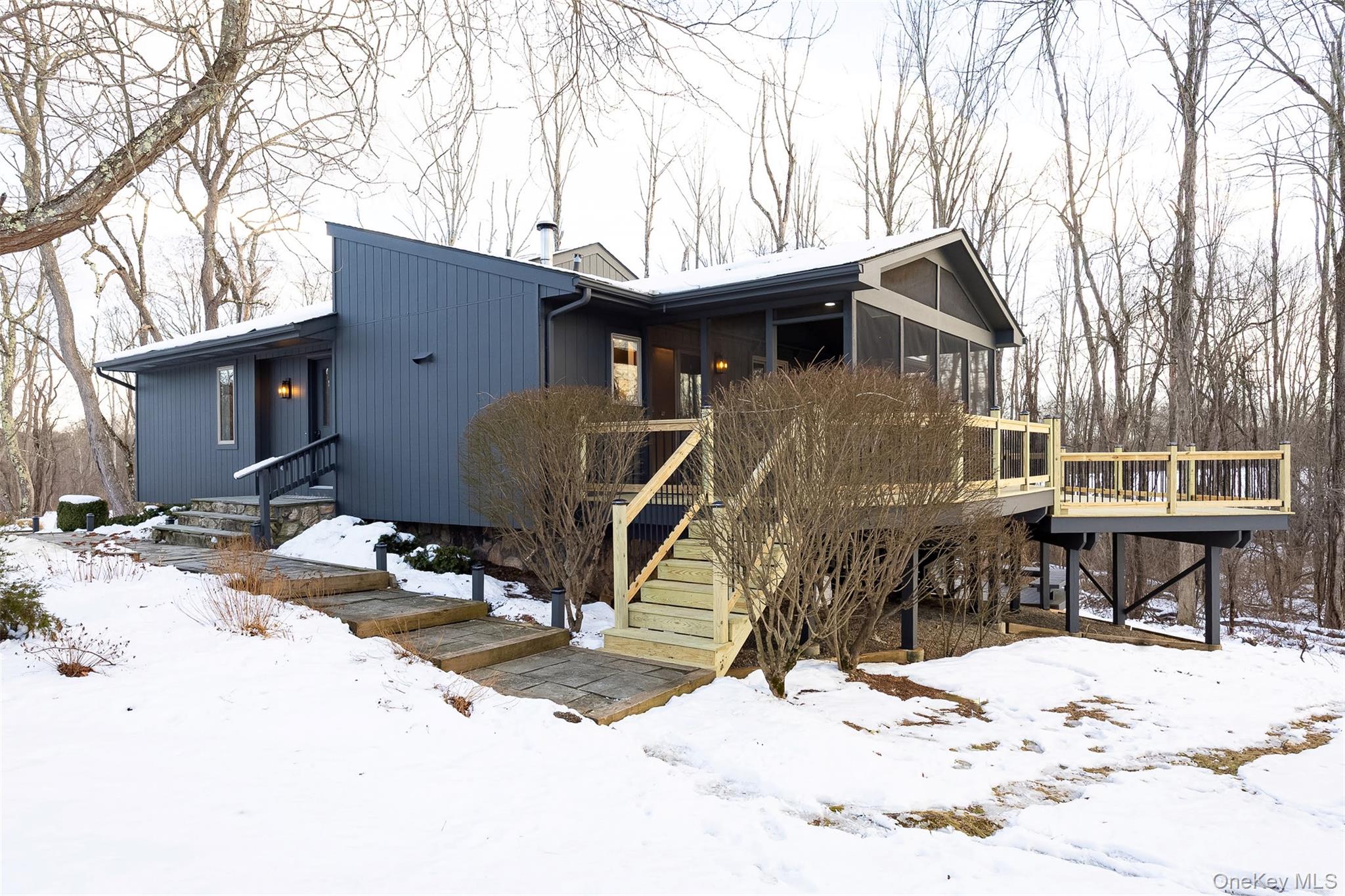 261 Freedom Road Pleasant Valley, NY 12569 - Photo 4 of 50 View of front of house featuring a sunroom, a deck, and stairs