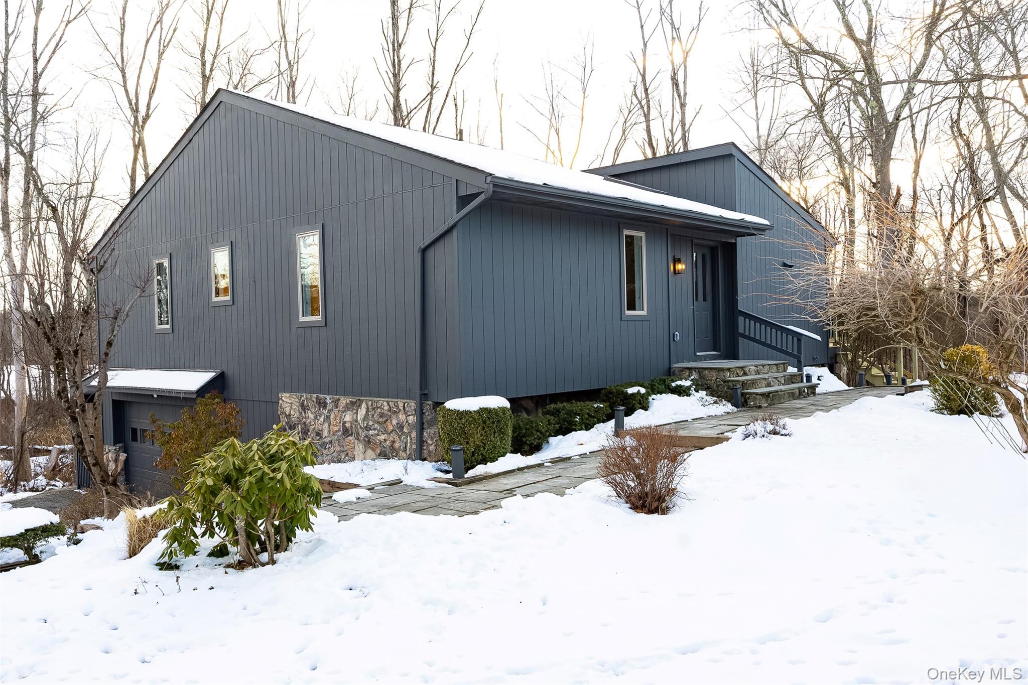 261 Freedom Road Pleasant Valley, NY 12569 - Photo 5 of 50 Snow covered property with an attached garage