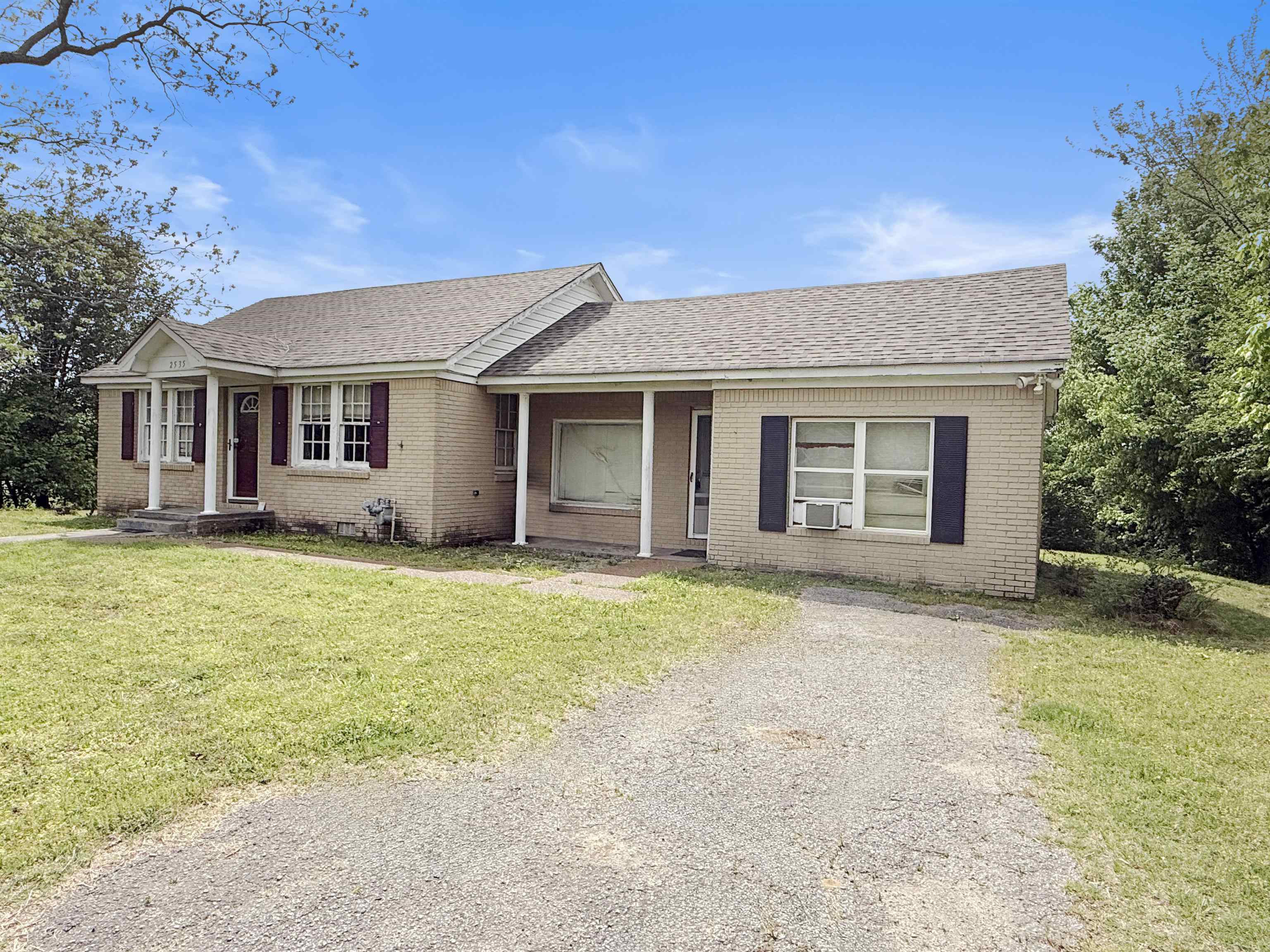 front view of a house with a yard
