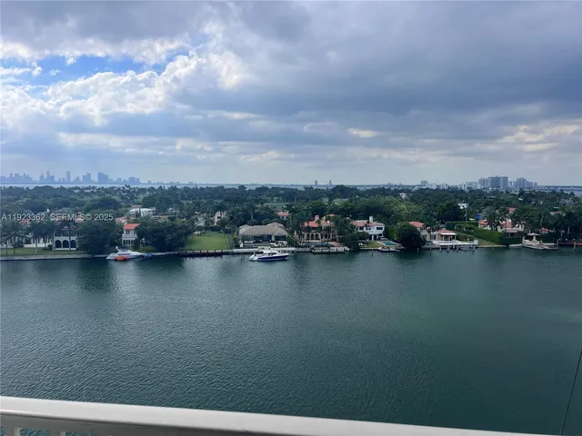 an aerial view of city and lake
