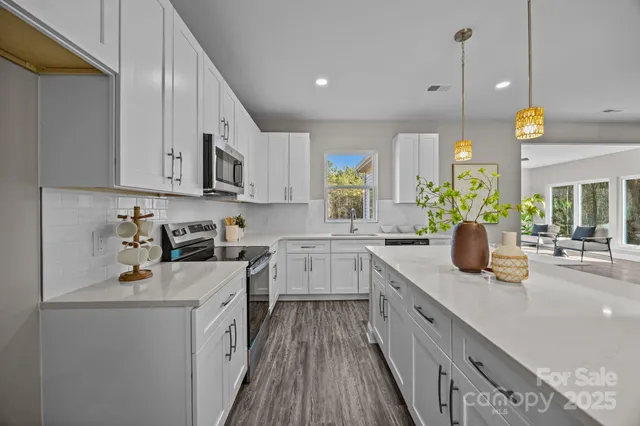 a kitchen with a sink stove and cabinets