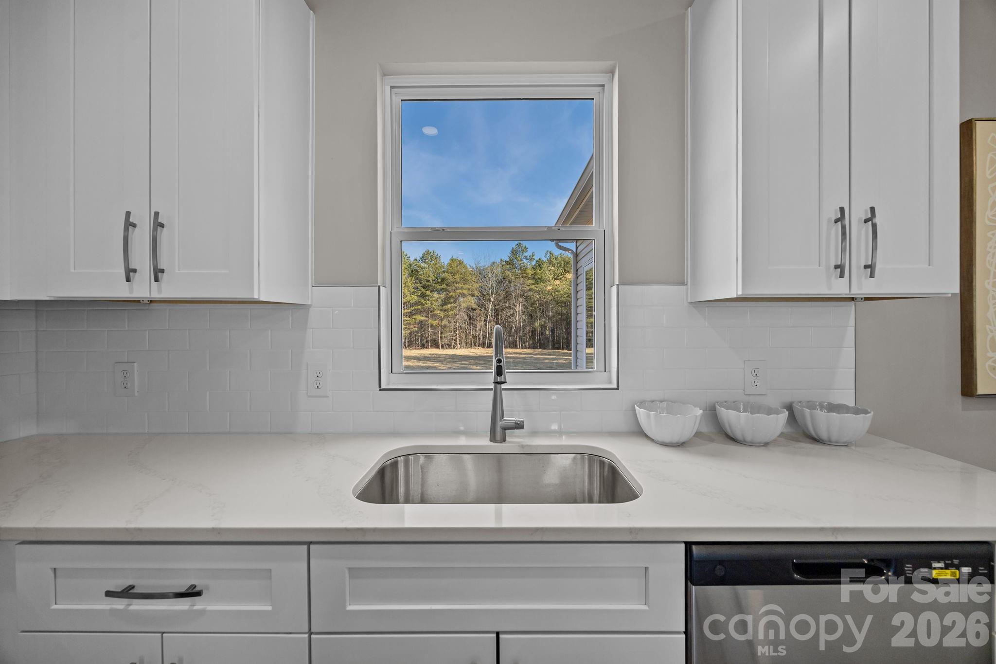 1813 Shuford Road Lincolnton, NC 28092 - Photo 16 of 47 a kitchen with a sink and cabinets