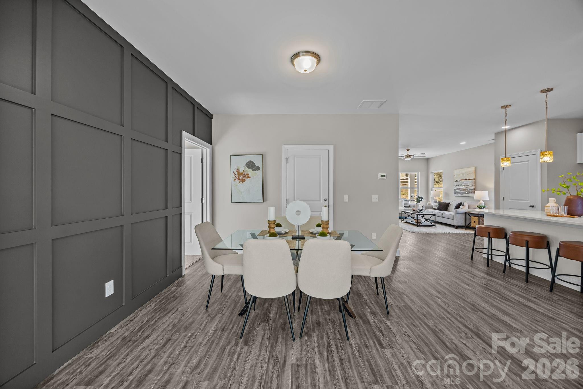 1813 Shuford Road Lincolnton, NC 28092 - Photo 19 of 47 a view of a dining room with furniture and wooden floor