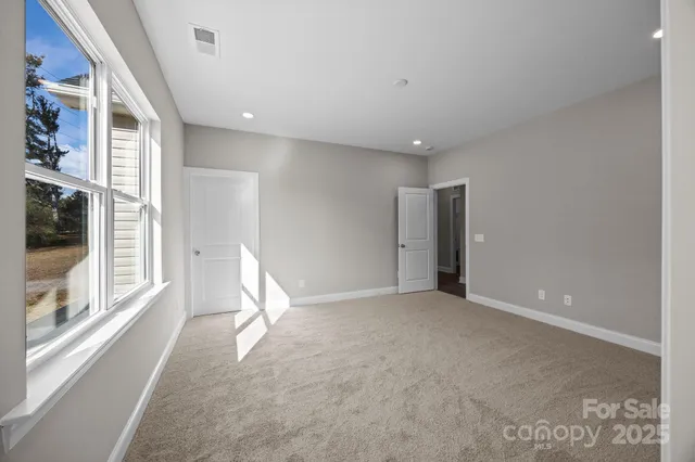 a view of an empty room with glass door