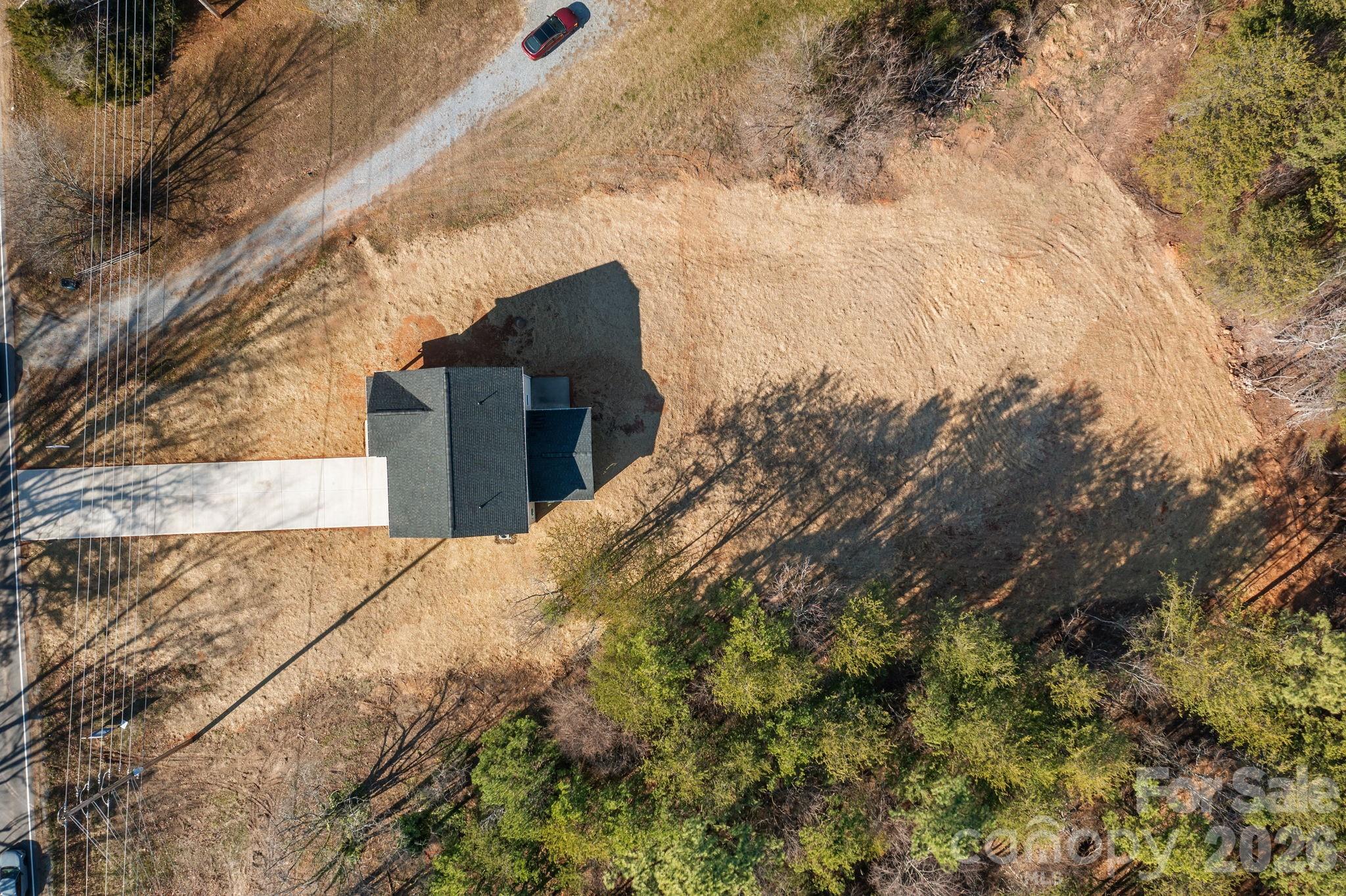 1813 Shuford Road Lincolnton, NC 28092 - Photo 41 of 47 a view of a yard with plants and a brick wall