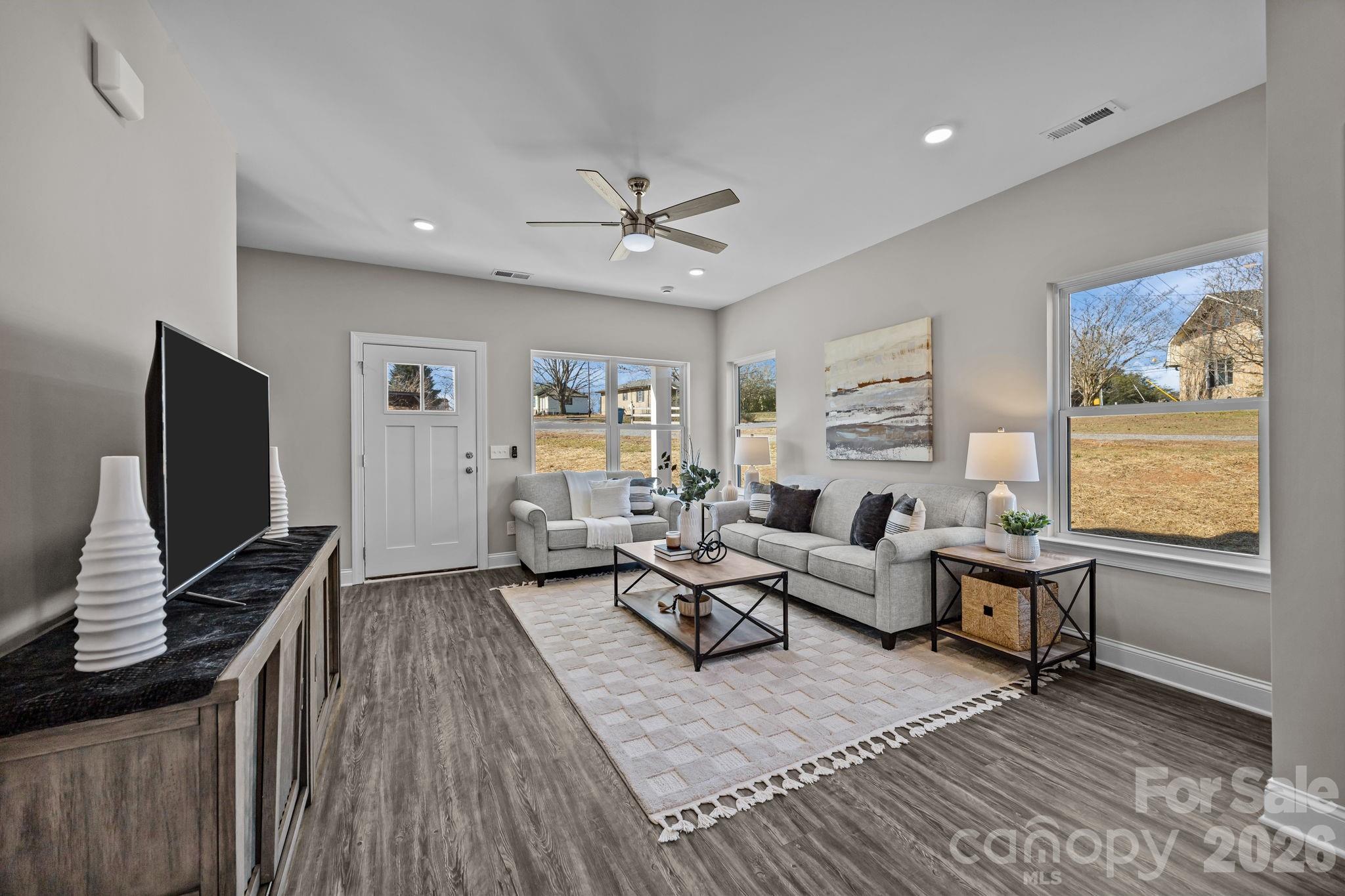 1813 Shuford Road Lincolnton, NC 28092 - Photo 8 of 47 a living room with furniture a window and a flat screen tv