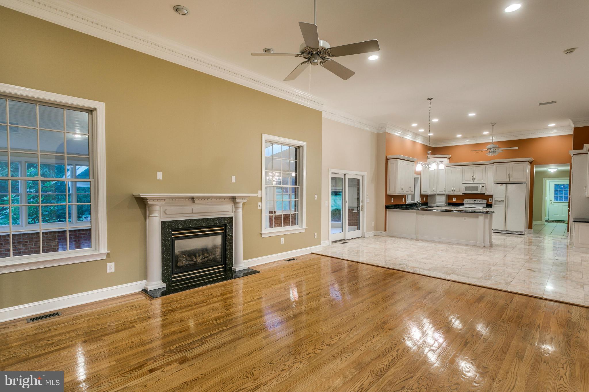 1900 Watervale Road Fallston, MD 21047 - Photo 4 of 30 a view of an empty room with a kitchen and a fireplace