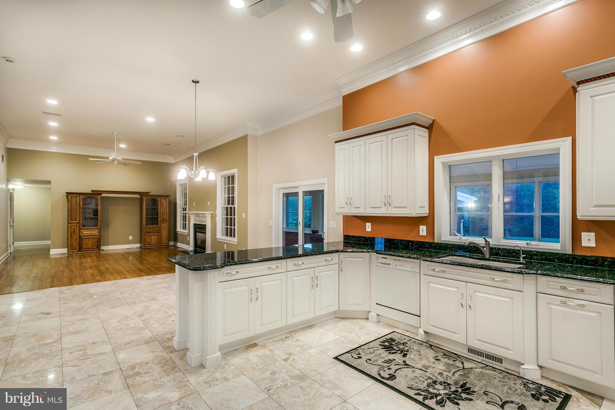 1900 Watervale Road Fallston, MD 21047 - Photo 5 of 30 a large white kitchen with a large window and couch