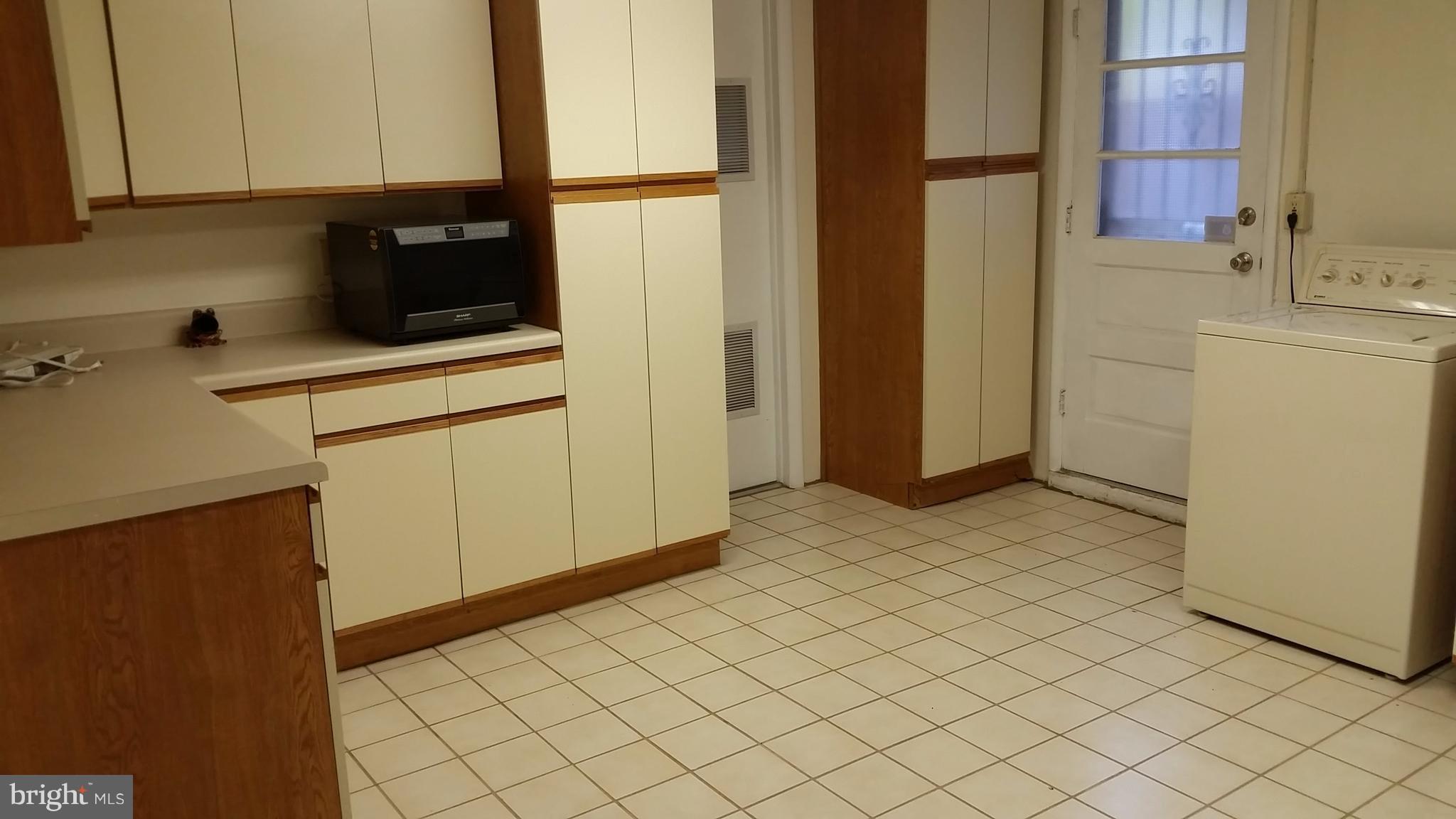 10609 Gorman Road Laurel, MD 20723 - Photo 24 of 28 Laundry Room with lots of cabinets