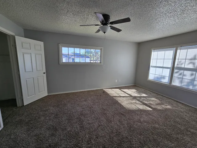 a view of empty room with windows