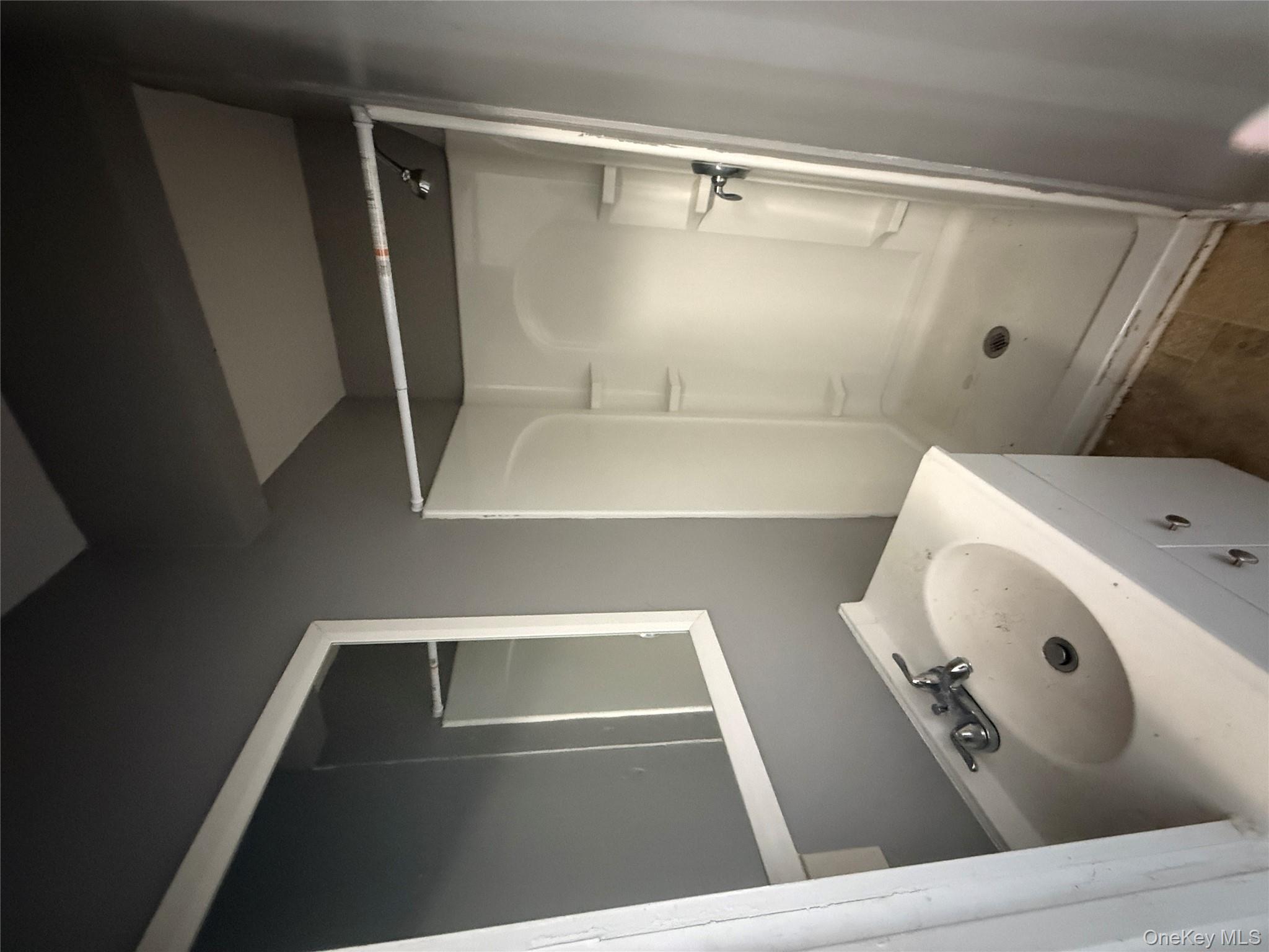 60 Carroll Street, Unit C3 Poughkeepsie, NY 12601 - Photo 13 of 19 a bathroom with a sink and shower