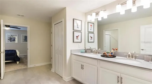 a bathroom with a sink double vanity and a mirror
