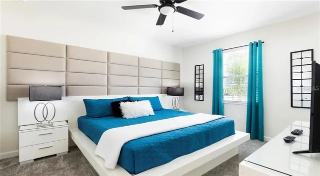 a bedroom with a large bed and a window