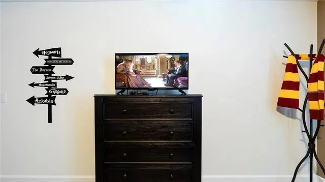 a room with a dresser and a mirror