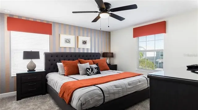 a bedroom with a bed and window