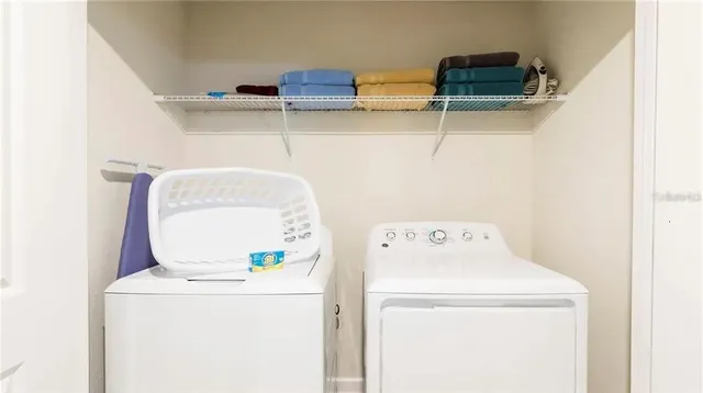 a utility room with dryer and washer