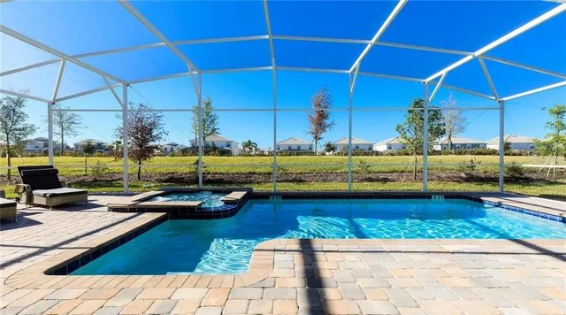 a view of a swimming pool with a lounge chairs
