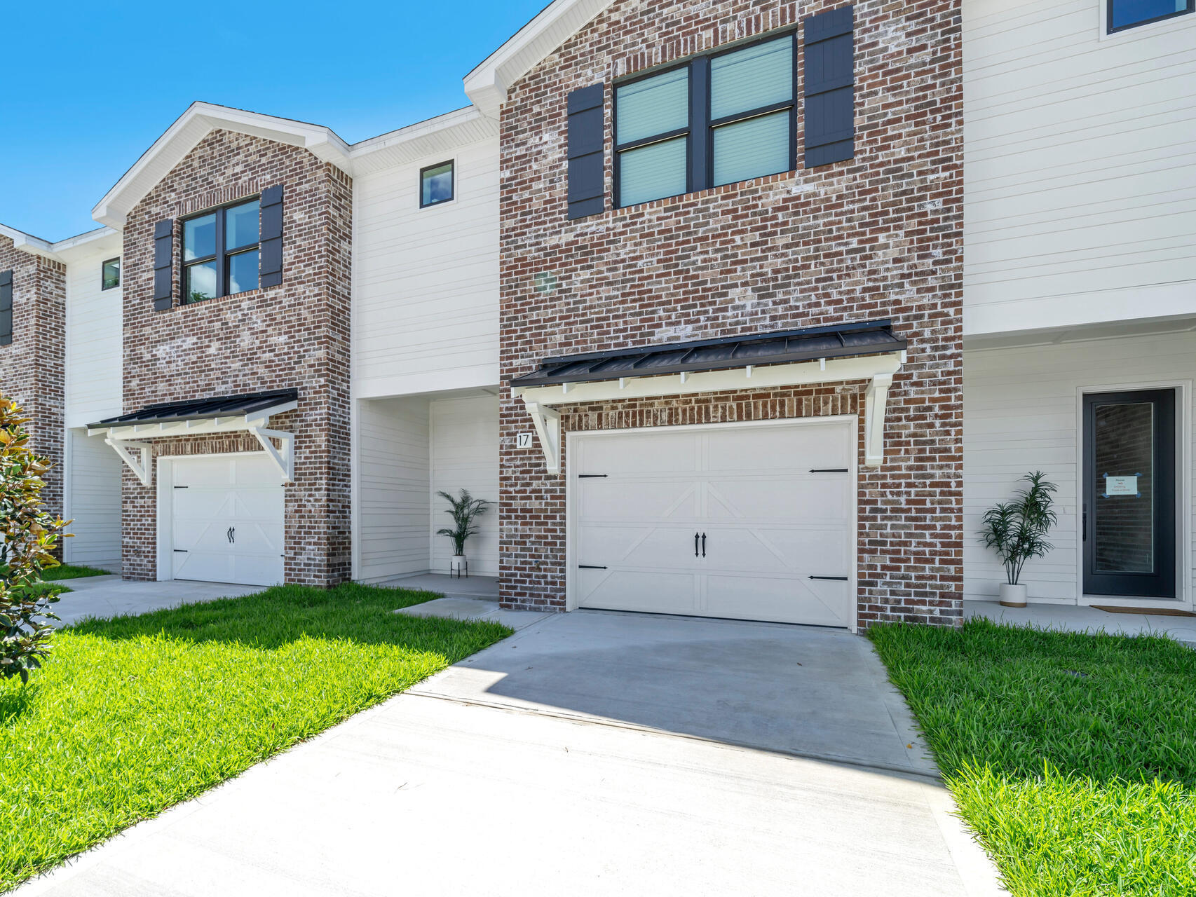 140 Sibert Avenue, Unit 11 Destin, FL 32541 - Photo 30 of 38 a view of a house with a yard