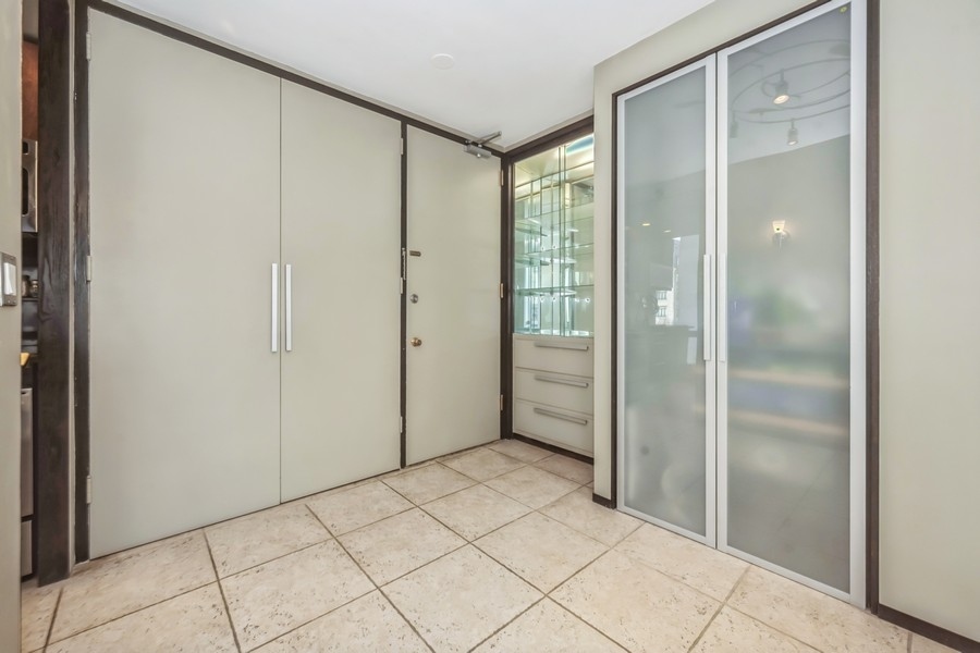 1300 North Astor Street, Unit 6B Chicago, IL 60610 - Photo 5 of 10 a view of a bathroom with a glass door