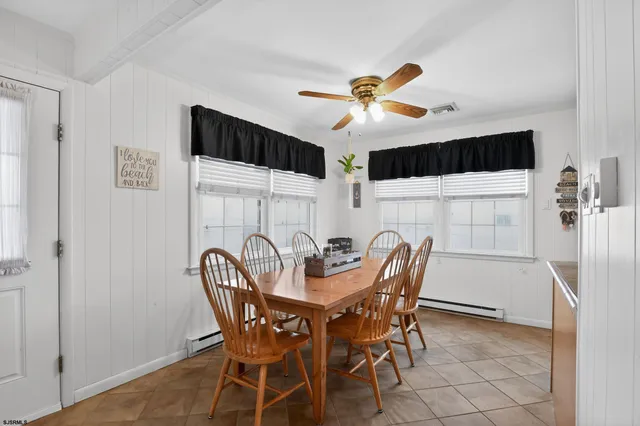 a dining room with furniture and window