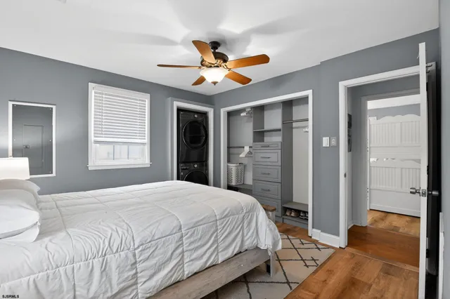 a bedroom with a bed and a walk in closet