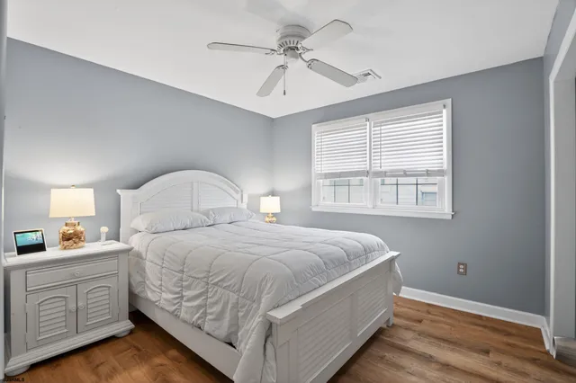 a bedroom with bed and window